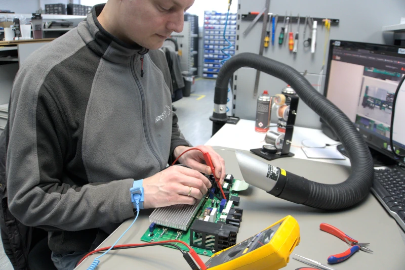 Technician measures on a circuit board